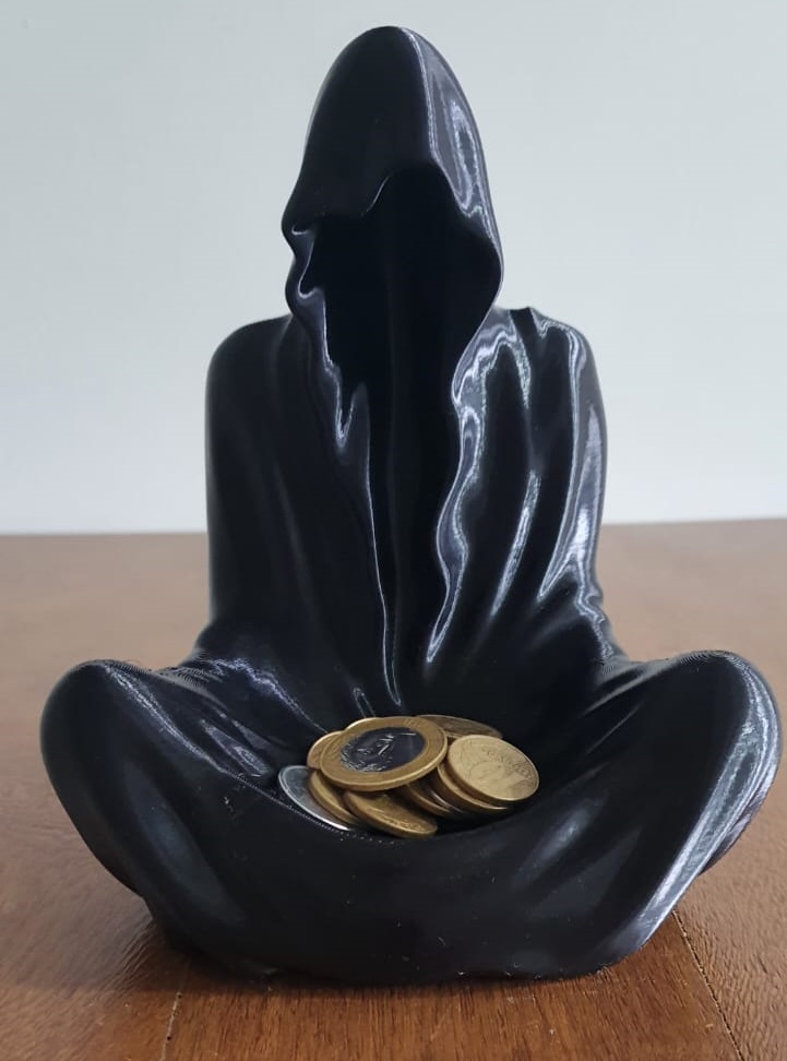 Figurica za novac ili sveće u obliku duha